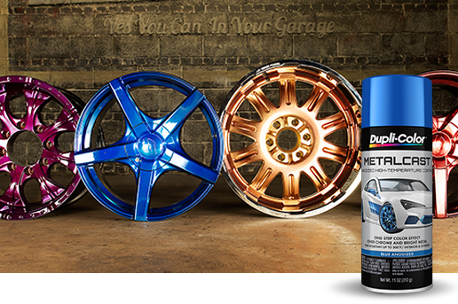 Can of metalcast spray paint in front of different color automotive wheels